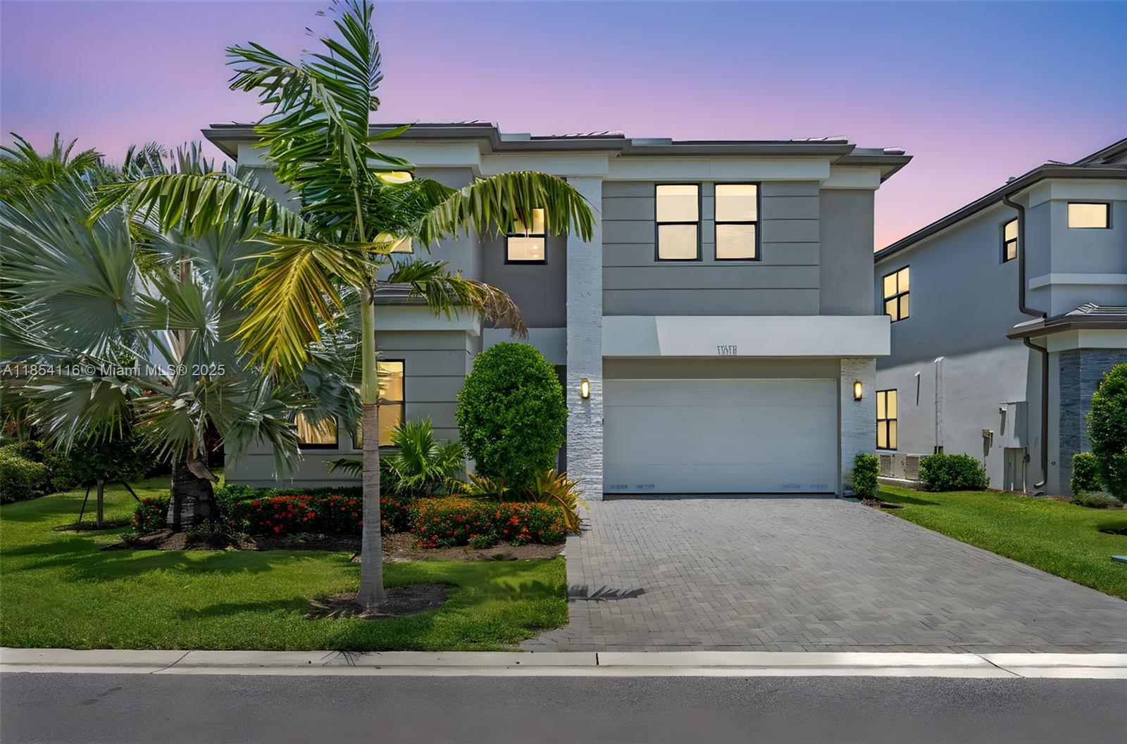 17117 Teton River Road Boca Raton, FL 33496 - Photo 3 of 77 a front view of a house with a yard and garage