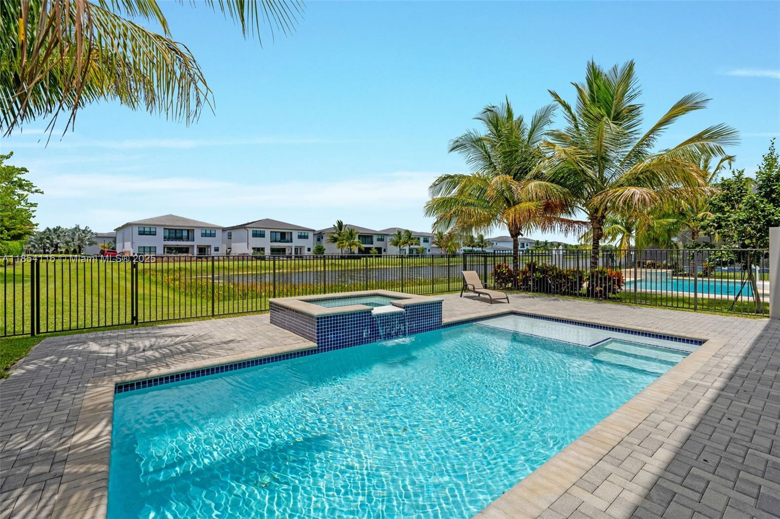17117 Teton River Road Boca Raton, FL 33496 - Photo 4 of 77 a view of a swimming pool with a garden and seating area