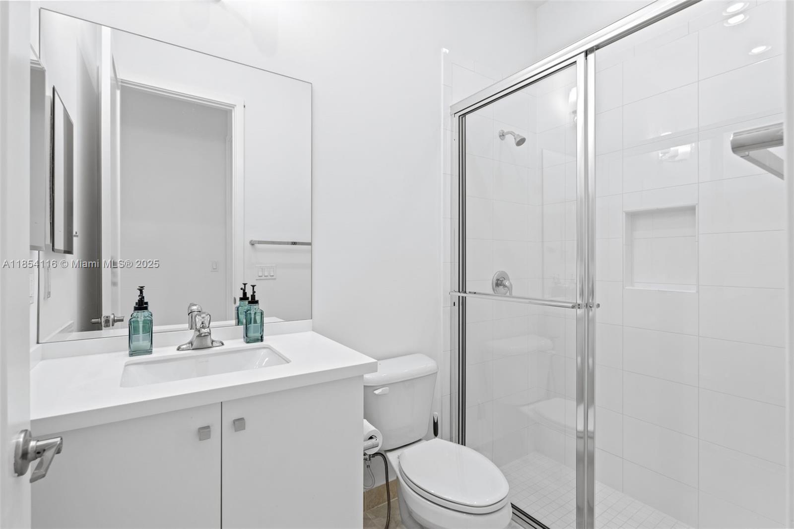 17117 Teton River Road Boca Raton, FL 33496 - Photo 48 of 77 a bathroom with a sink a toilet and shower