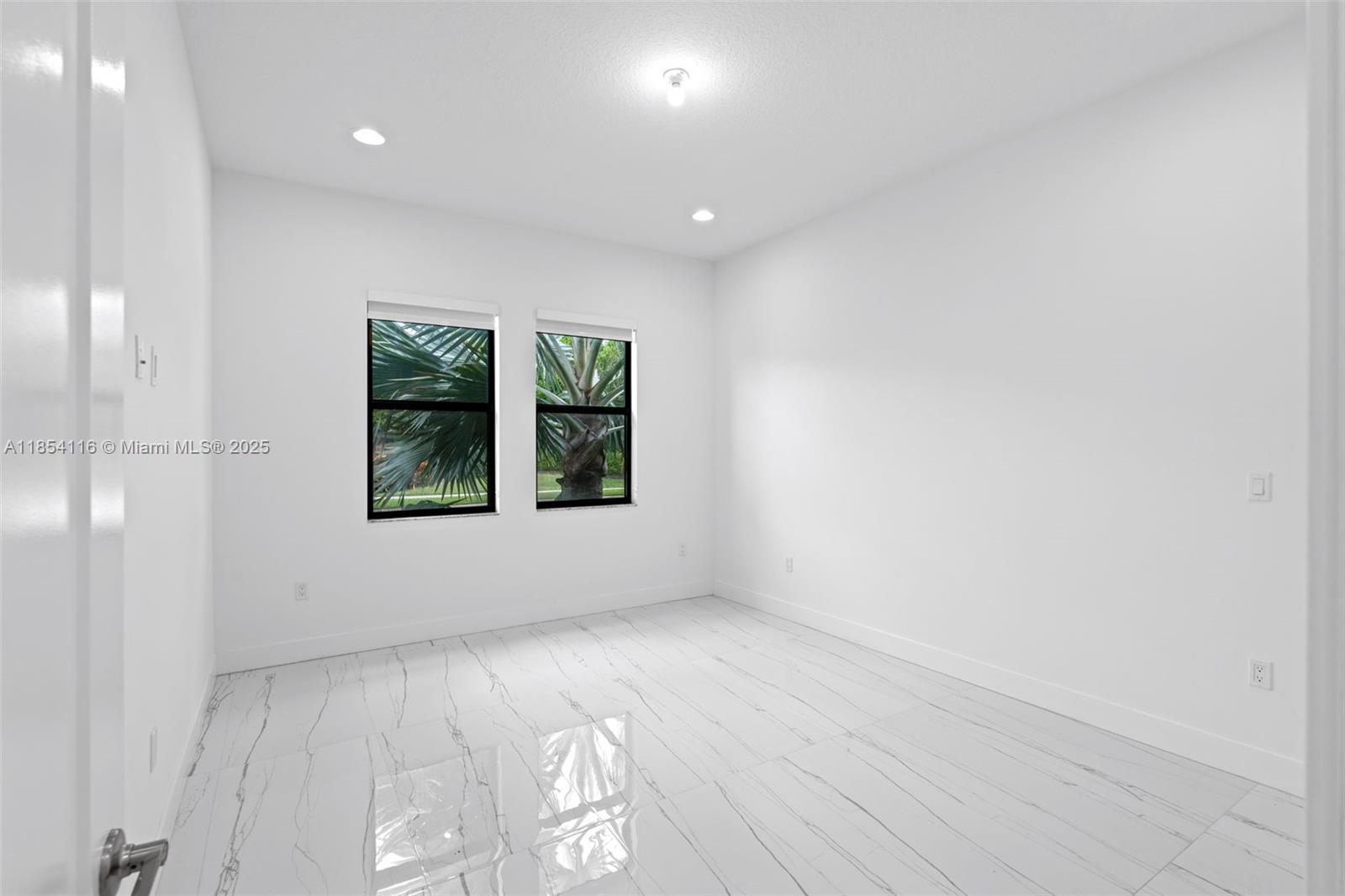 17117 Teton River Road Boca Raton, FL 33496 - Photo 50 of 77 an empty room with windows