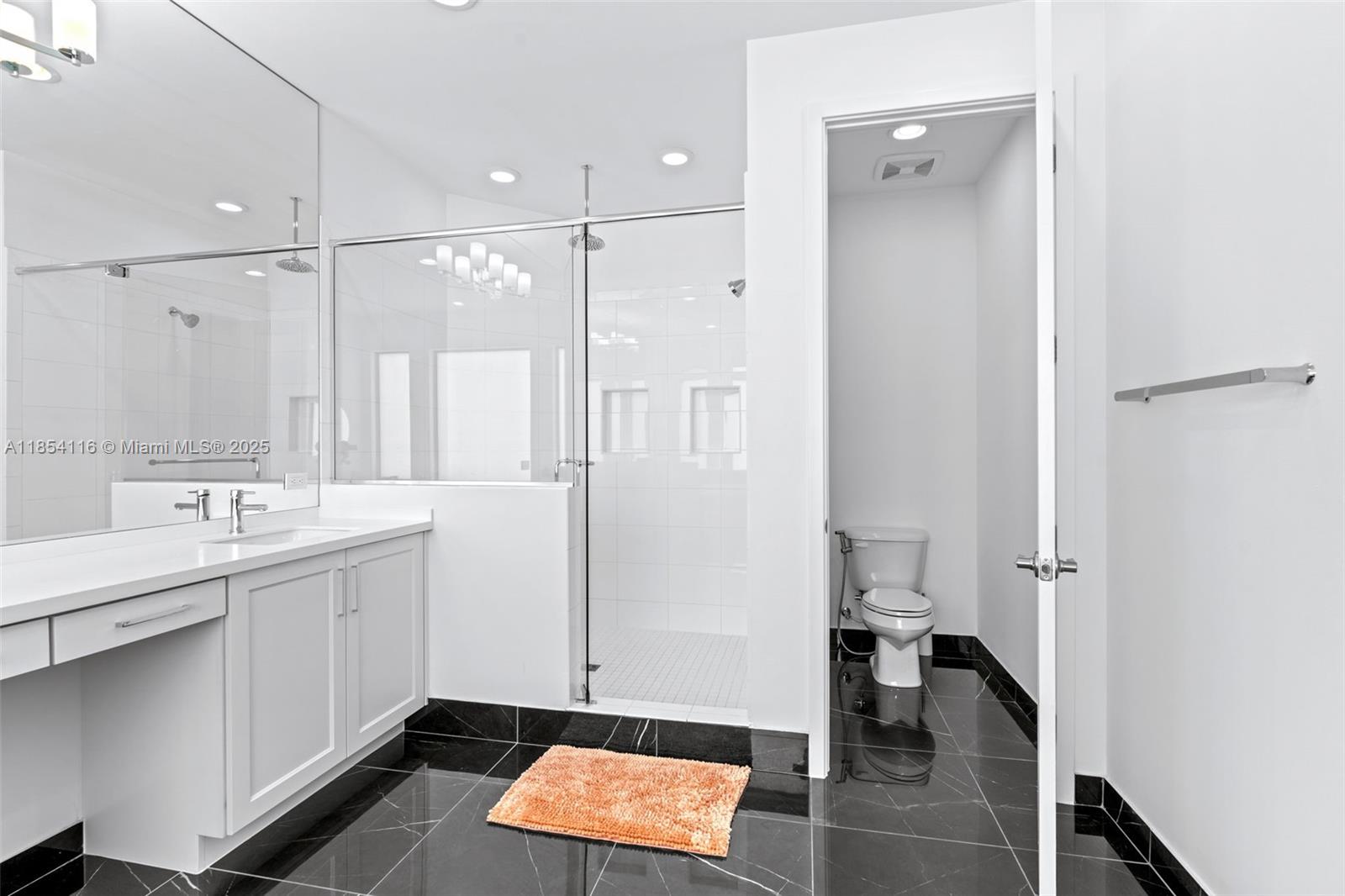 17117 Teton River Road Boca Raton, FL 33496 - Photo 53 of 77 a bathroom with a sink and a mirror