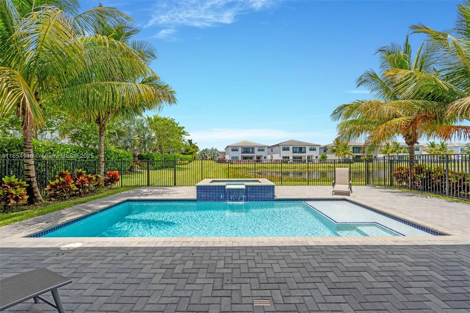 17117 Teton River Road Boca Raton, FL 33496 - Photo 60 of 77 a view of a swimming pool with an outdoor space and seating area