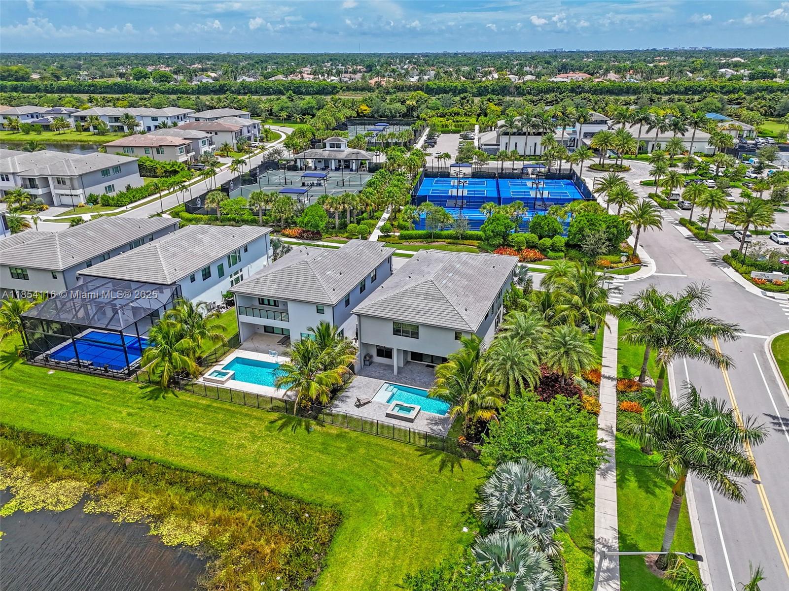 17117 Teton River Road Boca Raton, FL 33496 - Photo 67 of 77 an aerial view of residential houses with outdoor space and trees