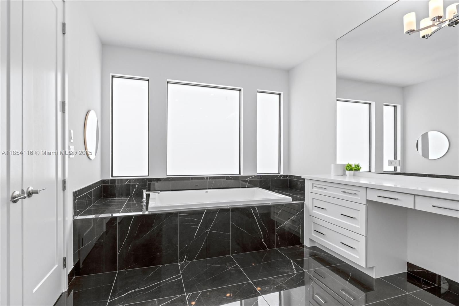 17117 Teton River Road Boca Raton, FL 33496 - Photo 8 of 77 a bathroom with a sink and a bathtub