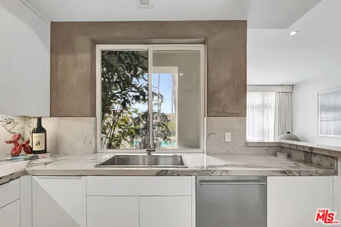 a kitchen with a sink and a window