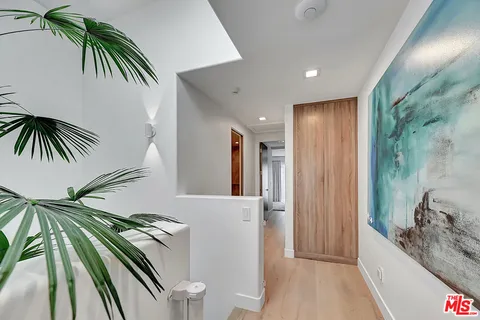 a view of a hallway to a hallway