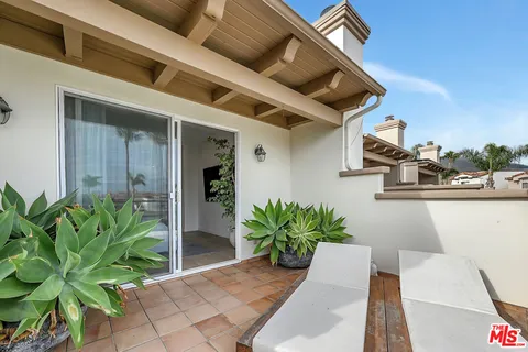 a roof deck with patio