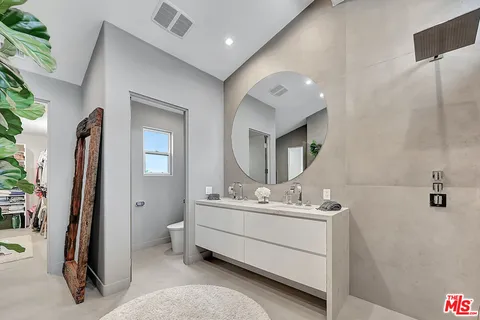 a bathroom with a shower and a sink