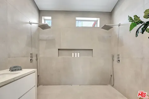 a bathroom with sink and mirror