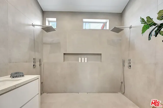 a bathroom with sink and mirror
