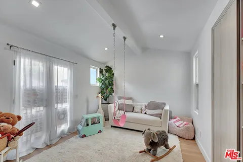a bathroom with a sink mirror vanity and toilet