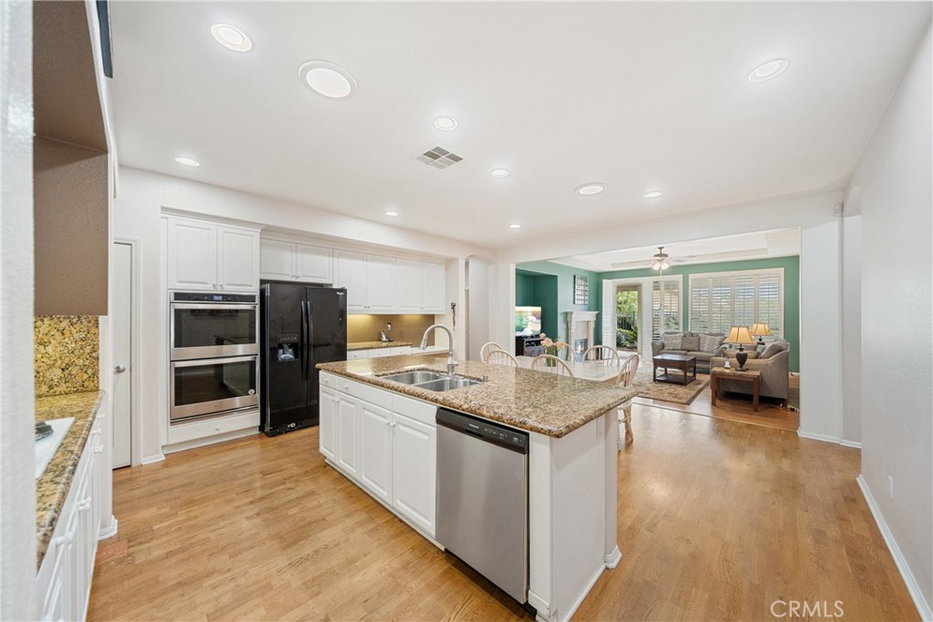 28713 Raintree Drive Menifee, CA 92584 - Photo 12 of 56 a kitchen with sink and refrigerator