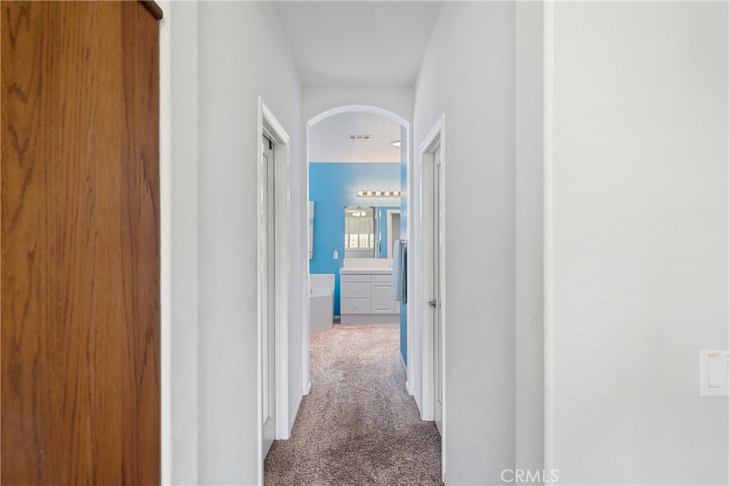 28713 Raintree Drive Menifee, CA 92584 - Photo 21 of 56 a view of a hallway with wooden floor