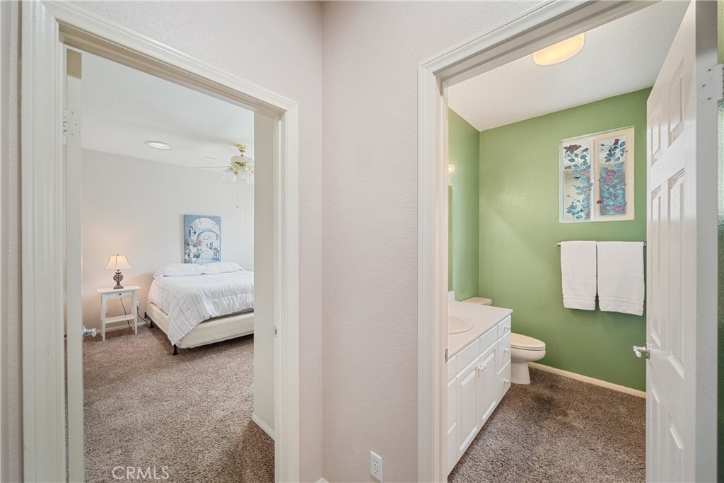 28713 Raintree Drive Menifee, CA 92584 - Photo 24 of 56 a en suite bathroom with a sink and a mirror