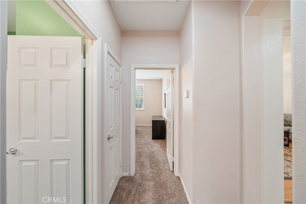 28713 Raintree Drive Menifee, CA 92584 - Photo 28 of 56 a view of a bathroom from a hallway