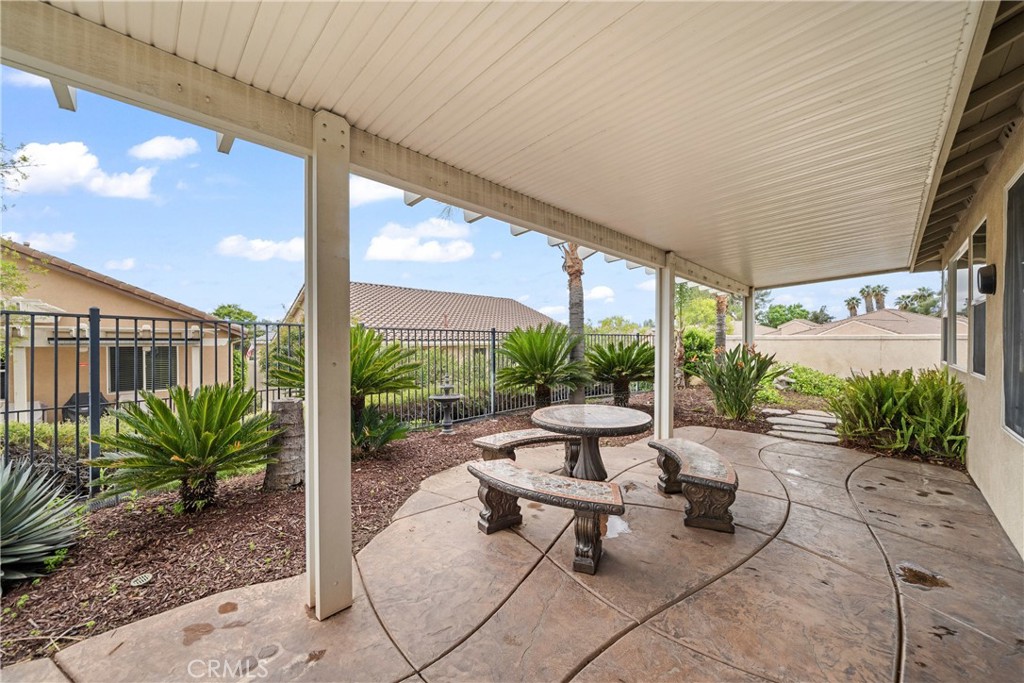 28713 Raintree Drive Menifee, CA 92584 - Photo 31 of 56 a view of a patio with plants and table in patio