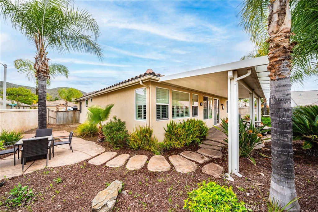 28713 Raintree Drive Menifee, CA 92584 - Photo 33 of 56 a view of a house with backyard and sitting area