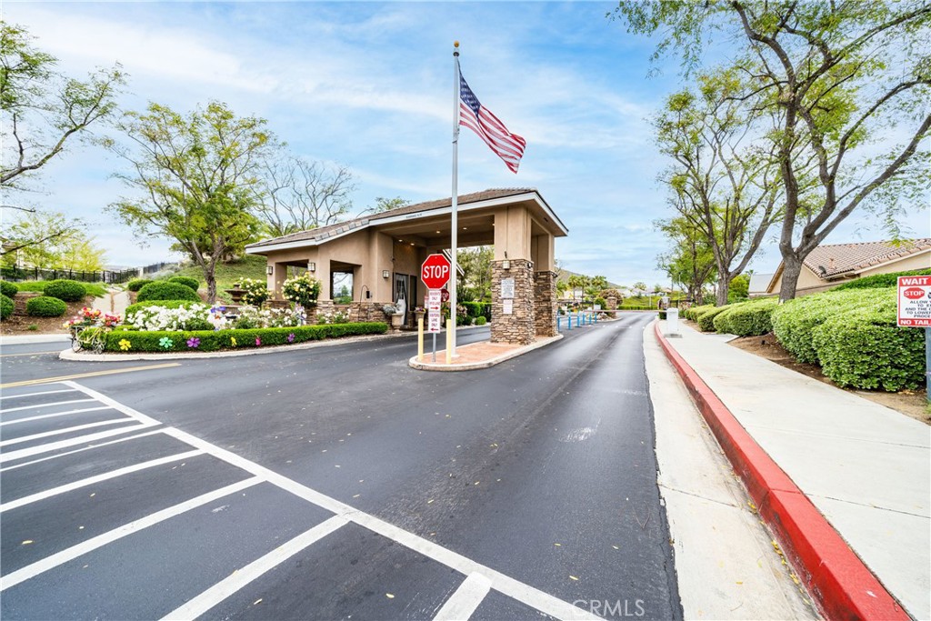 28713 Raintree Drive Menifee, CA 92584 - Photo 36 of 56 a view of a street with a house in the background