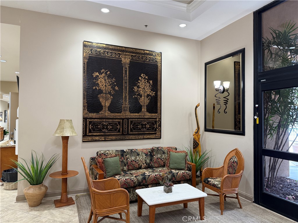 28713 Raintree Drive Menifee, CA 92584 - Photo 49 of 56 a living room with furniture and a potted plant