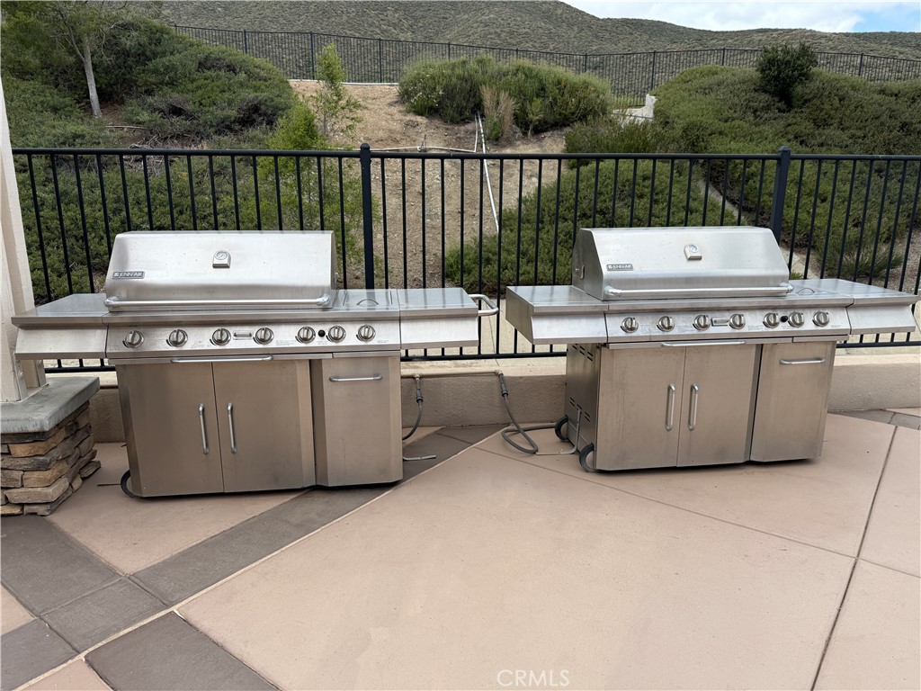 28713 Raintree Drive Menifee, CA 92584 - Photo 54 of 56 a view of a patio with a table and chairs