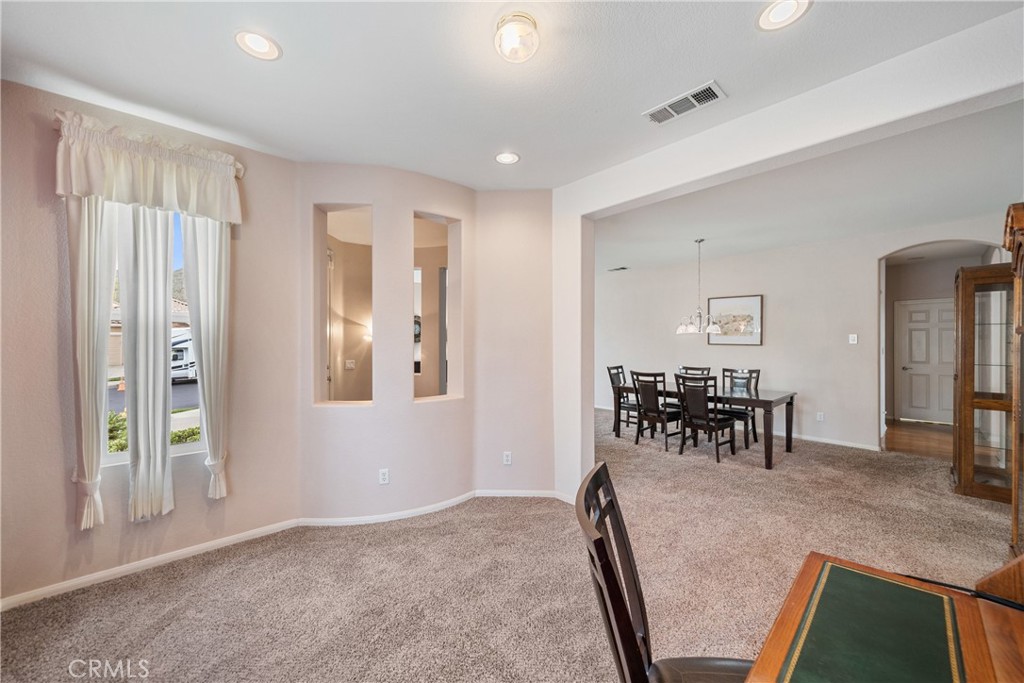 28713 Raintree Drive Menifee, CA 92584 - Photo 8 of 56 a view of dining room with furniture and chandelier