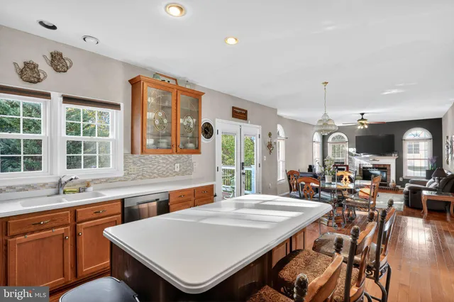 a living room with furniture rug and window
