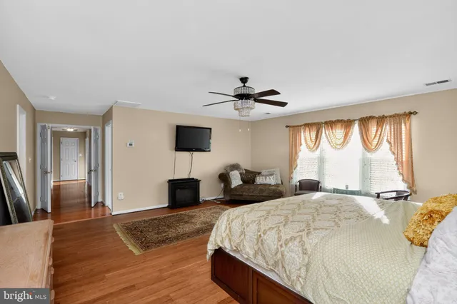 a bed room with a bed and a dresser