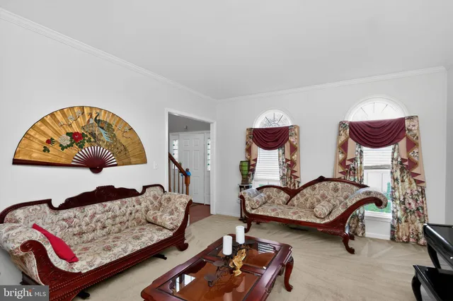 a living room with furniture and gym equipment