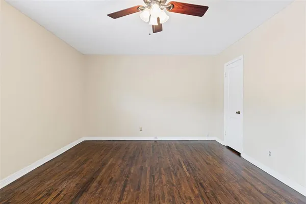 an empty room with wooden floor