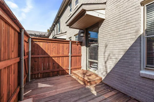 view of balcony with wooden floor and stairs