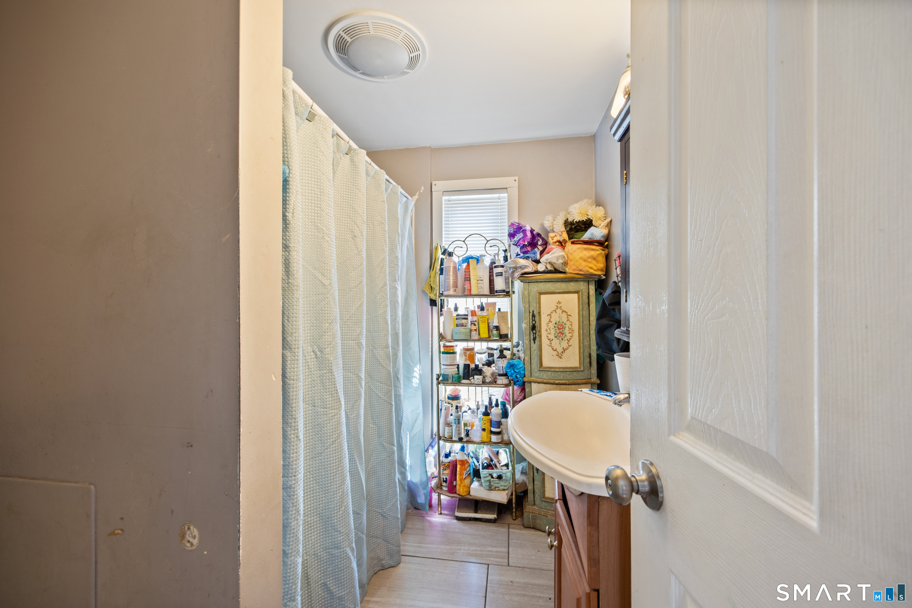 277 South Main Street Torrington, CT 06790 - Photo 21 of 26 a view of a hallway and a dining room with furniture