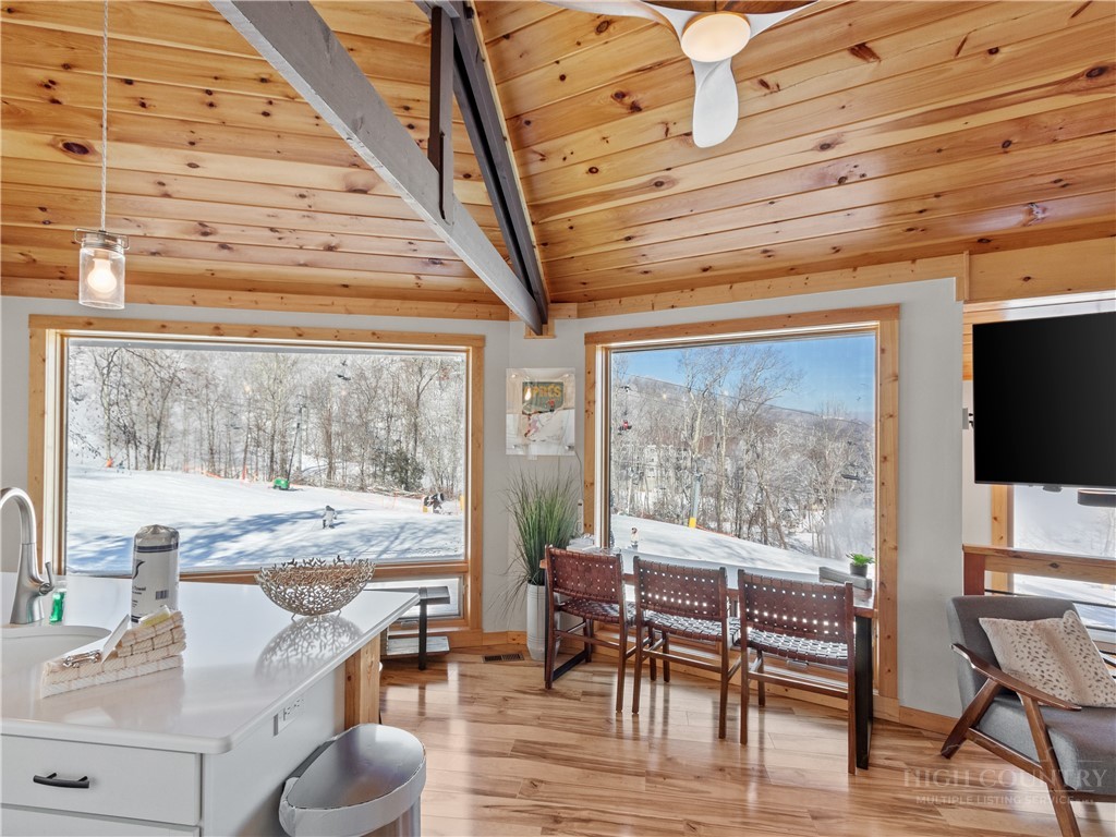 630 Briarcliff Road Sugar Mountain, NC 28604 - Photo 12 of 28 a view of a dining room with furniture window and outside view