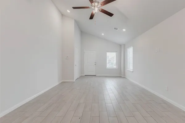 a view of an empty room with a window