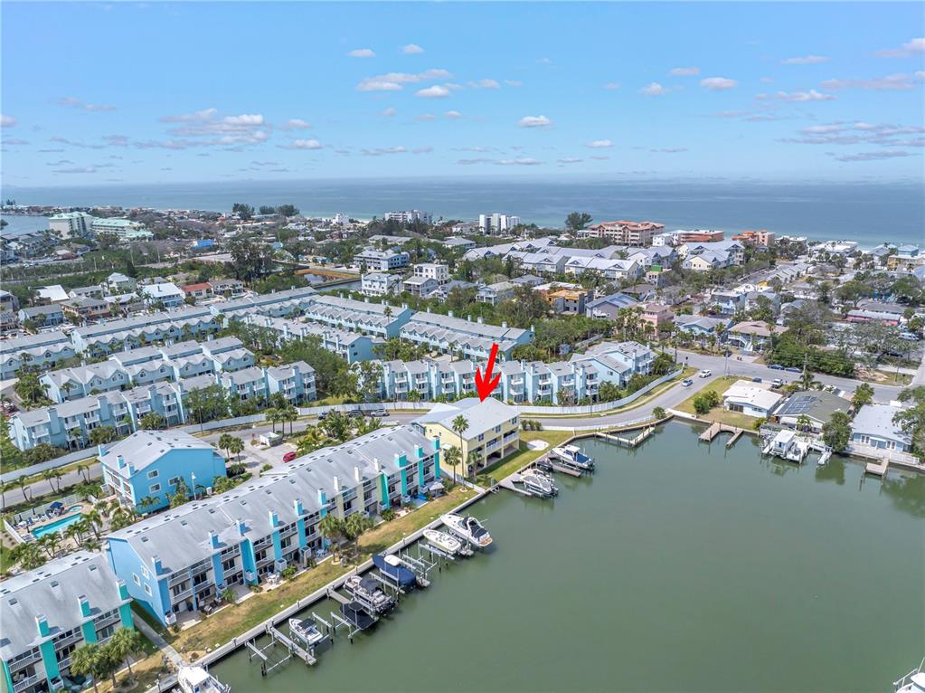 100 Windrush Boulevard, Unit 1 Indian Rocks Beach, FL 33785 - Photo 1 of 37 an aerial view of city and lake
