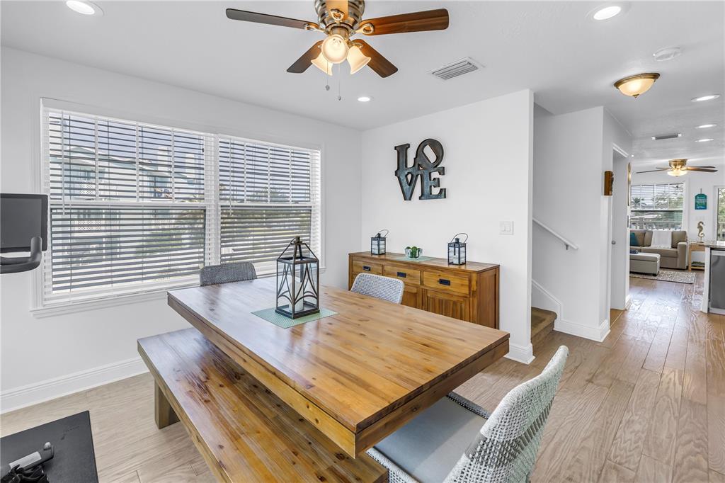 100 Windrush Boulevard, Unit 1 Indian Rocks Beach, FL 33785 - Photo 12 of 37 a living room with furniture and wooden floor