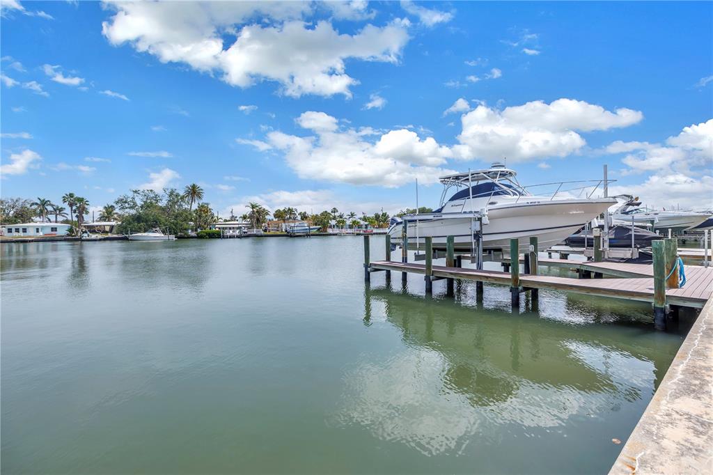 100 Windrush Boulevard, Unit 1 Indian Rocks Beach, FL 33785 - Photo 27 of 37 a view of a lake with houses