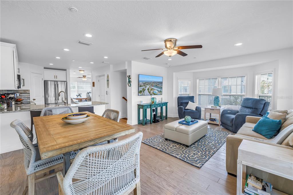 100 Windrush Boulevard, Unit 1 Indian Rocks Beach, FL 33785 - Photo 6 of 37 a living room with furniture kitchen view and a table