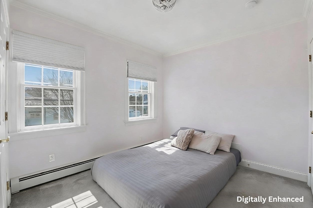 183 Whiting Street Hanover, MA 02339 - Photo 27 of 42 a bedroom with a bed and window