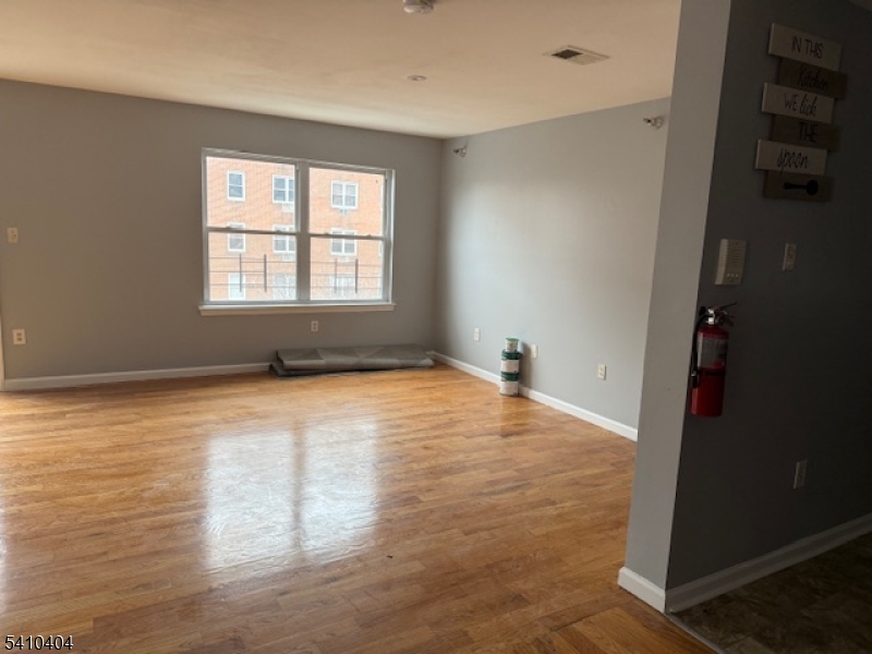 89 Chadwick Avenue, Unit 3 Newark, NJ 07108 - Photo 2 of 28 an empty room with a window