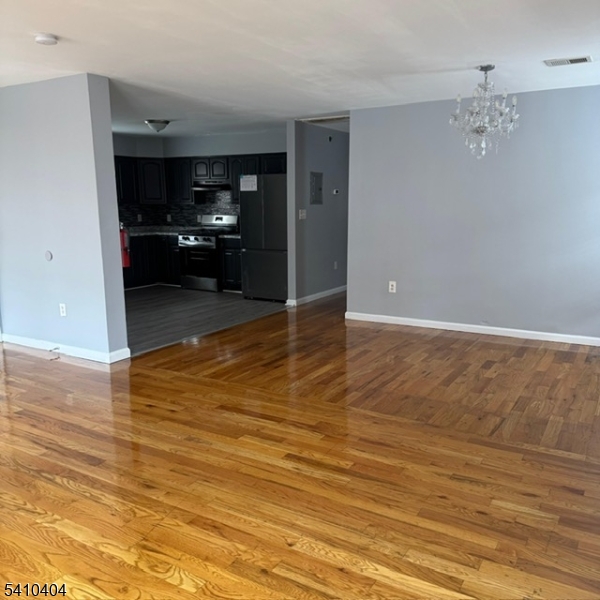 89 Chadwick Avenue, Unit 3 Newark, NJ 07108 - Photo 27 of 28 a view of a kitchen from the hallway