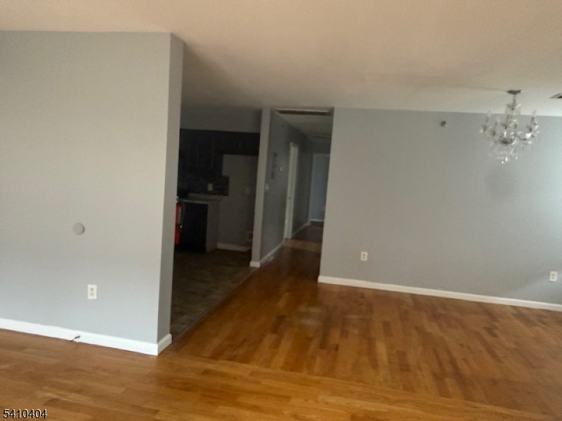 89 Chadwick Avenue, Unit 3 Newark, NJ 07108 - Photo 5 of 28 a view of a hallway with wooden floor