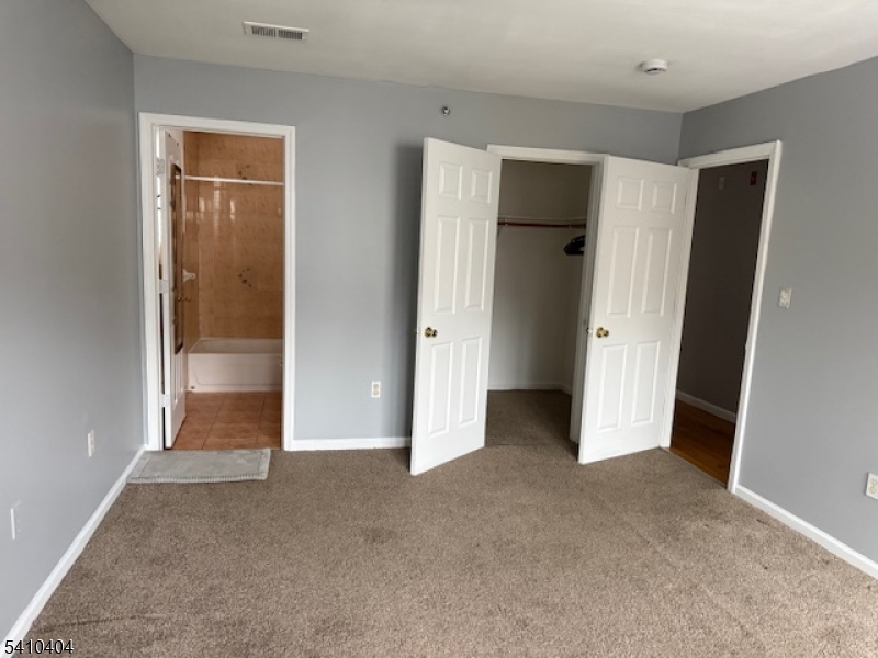 89 Chadwick Avenue, Unit 3 Newark, NJ 07108 - Photo 7 of 28 a view of an empty room with closet and wooden floor