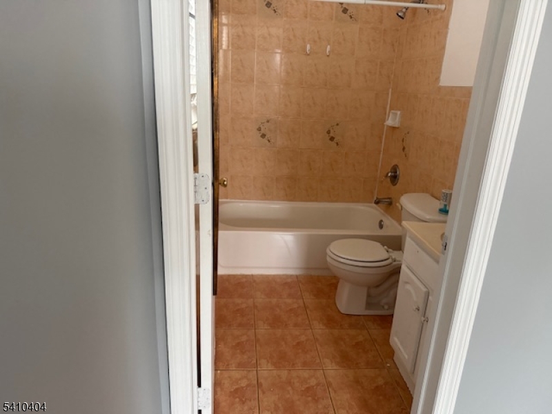 89 Chadwick Avenue, Unit 3 Newark, NJ 07108 - Photo 8 of 28 a bathroom with a toilet and a shower
