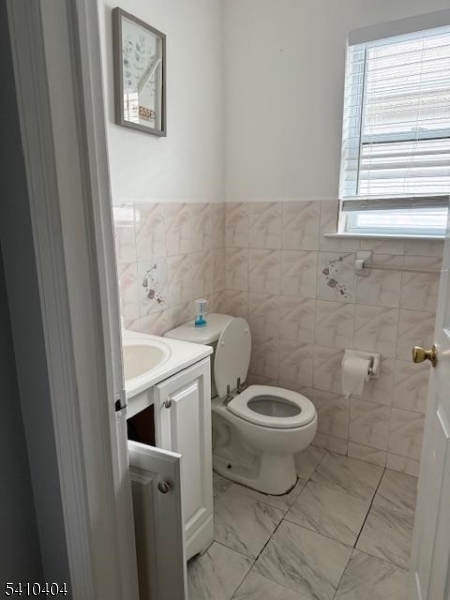 89 Chadwick Avenue, Unit 3 Newark, NJ 07108 - Photo 10 of 28 a bathroom with a toilet and a sink
