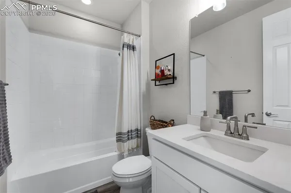 a bathroom with a sink a toilet and a bathtub
