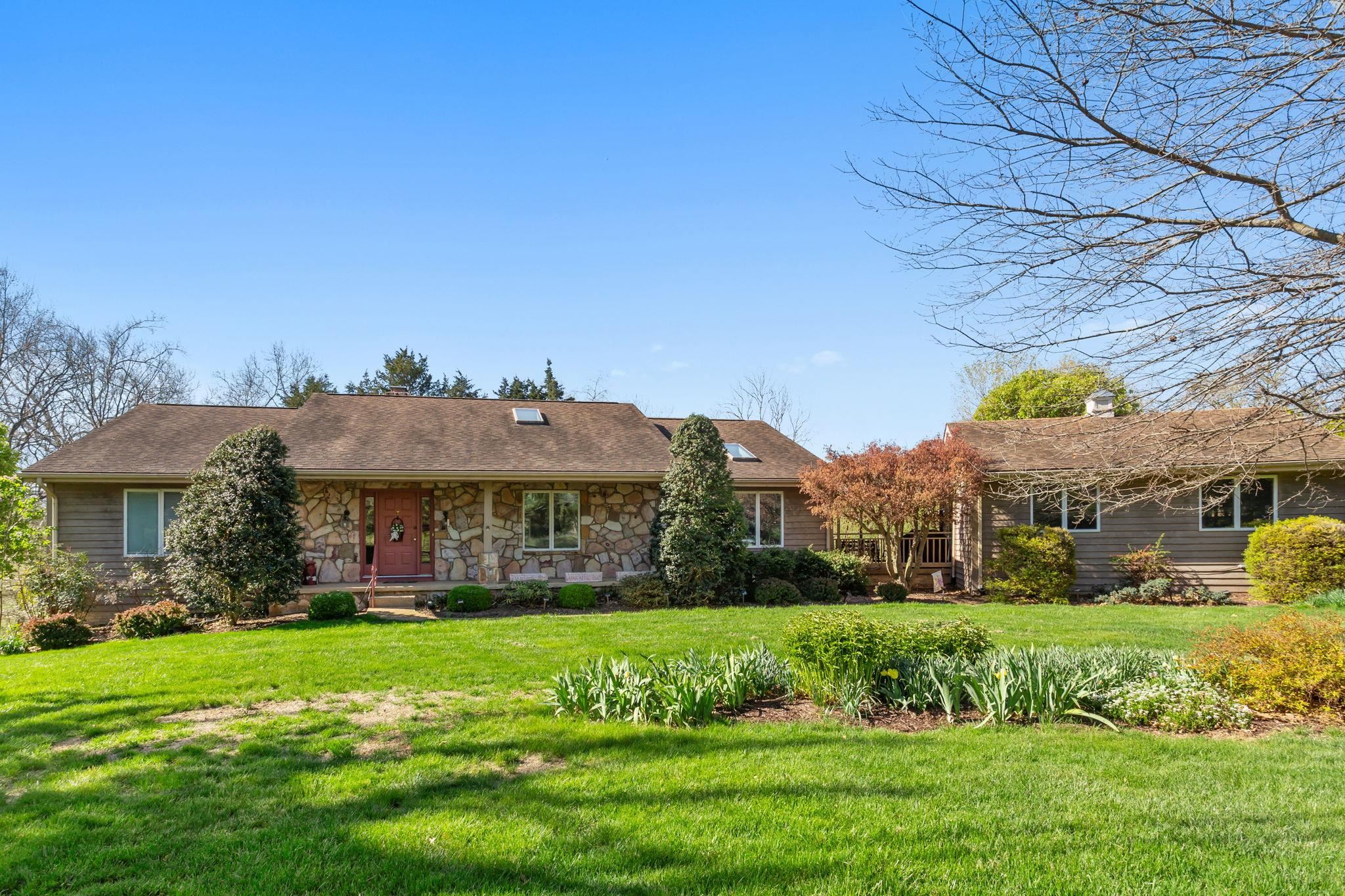 13004 Indian Trail Road Broadway, VA 22815 - Photo 2 of 56 a view of a house with a big yard potted plants and large tree