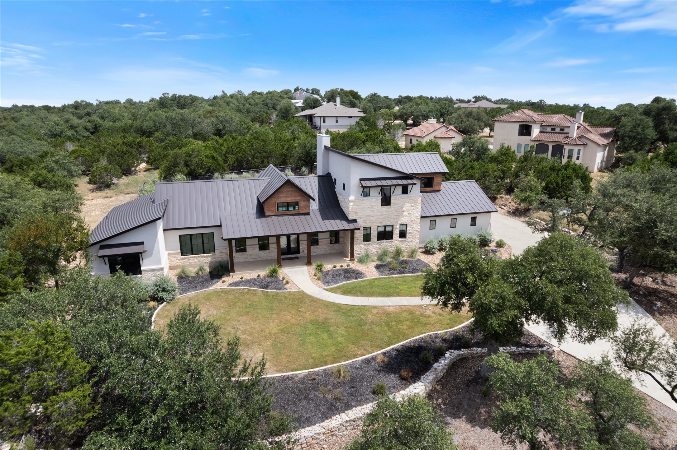 27619 Sunset Loop Garden Ridge, TX 78266 - Photo 37 of 39 An architectural masterpiece rises majestically amidst a lush, private woodland setting.