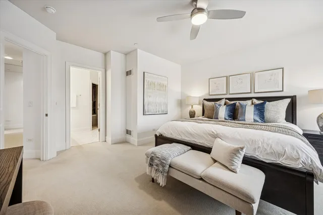 a bedroom with a bed couch and window