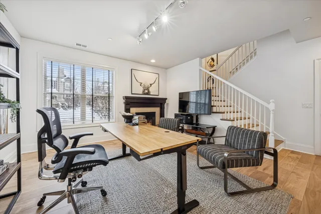 a bedroom with furniture and a wooden floor