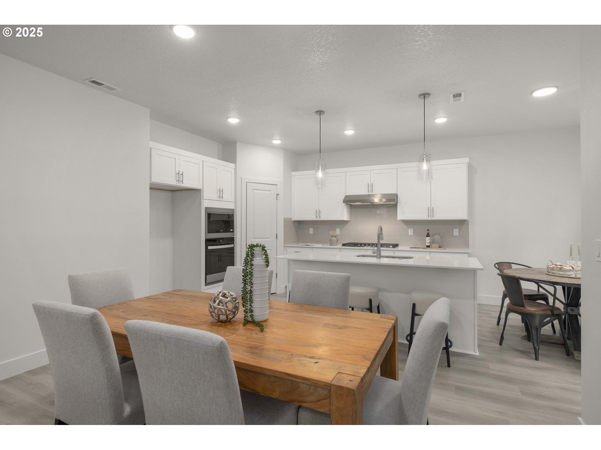 19040 Southwest Northridge Court, Unit LOT 15 Beaverton, OR 97007 - Photo 12 of 34 a kitchen with stainless steel appliances granite countertop a sink refrigerator and cabinets